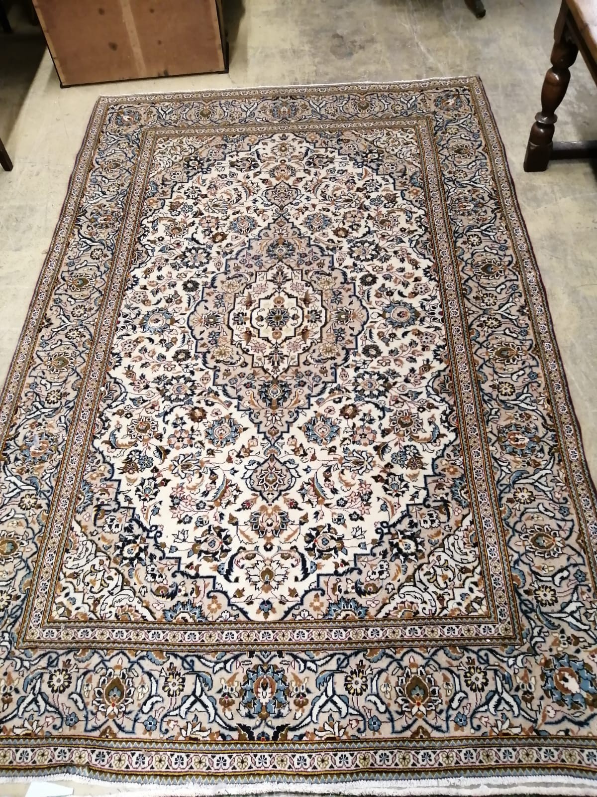 A Nomadic Rug Persian style carpet with foliate motifs on a cream ground, 300 x 195cm